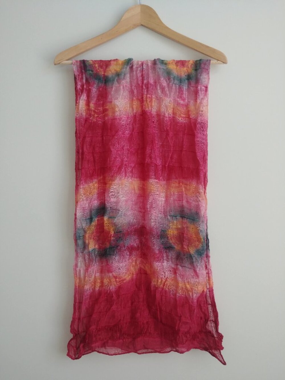 Deep pink tie dye look filmy scarf with blue and yellow circles